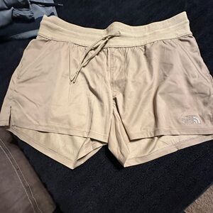 The Northface hiking type shorts. Size medium. Tan in color
